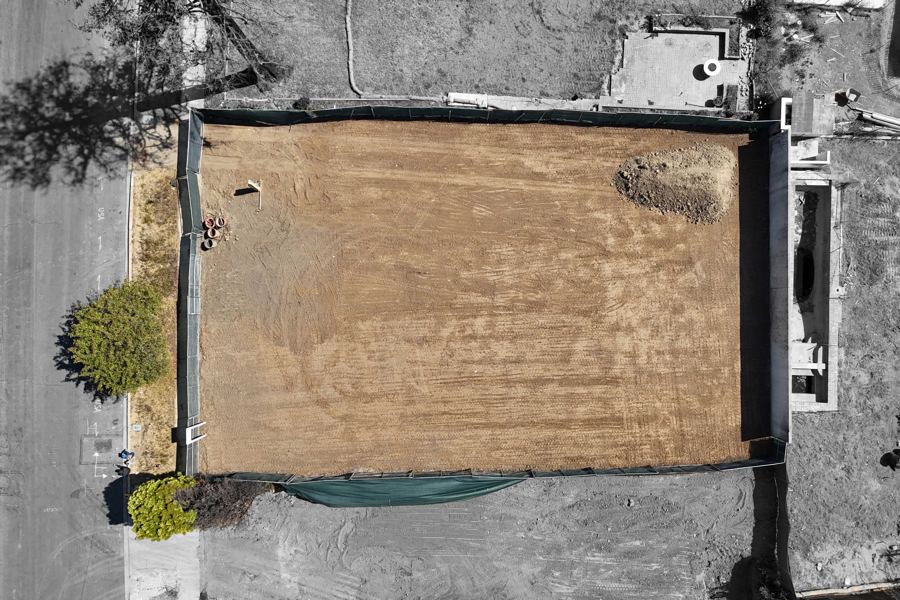 Overhead view of the cleared, fenced lot